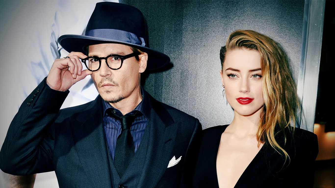 Johnny-Depp-e-Amber-Heard-juntos Amber Heard diz que foi rotulada de mentirosa porque Johnny Depp é mais famoso