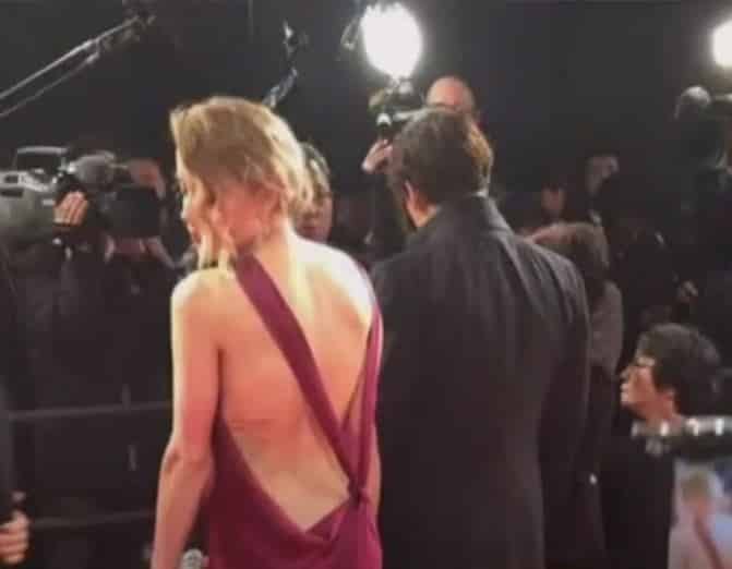 Amber-Heard-de-costas Amber Heard tenta explicar fotos sem lesões após supostas agressões de Johnny Depp